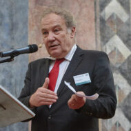 Martin Palous on a podium giving a speech.