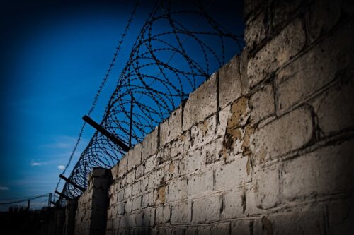 Barbed wire wall.